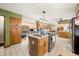Updated kitchen with granite counters, stainless appliances and breakfast bar featuring seating at 8968 Old Haggard Rd, Morgantown, IN 46160