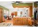 Kitchen featuring custom cabinets, granite counters, and center island with seating at 8968 Old Haggard Rd, Morgantown, IN 46160