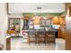 Sun-lit kitchen with a spacious island, stainless steel refrigerator, and a functional layout at 8968 Old Haggard Rd, Morgantown, IN 46160