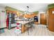 Traditional kitchen features an island with seating, stainless steel appliances, and tile flooring at 8968 Old Haggard Rd, Morgantown, IN 46160