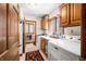 Functional laundry room features modern washer and dryer units, cabinetry, and a convenient layout at 8968 Old Haggard Rd, Morgantown, IN 46160
