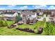 A picturesque aerial view showcases a well-maintained backyard, mature trees, and a private outdoor space at 9253 Windrift Way, Zionsville, IN 46077