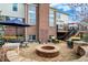 Outdoor patio with fire pit and ample seating, perfect for gatherings in the backyard at 9253 Windrift Way, Zionsville, IN 46077