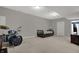 Spacious basement featuring a drum set, bed, and tv, perfect for entertainment and relaxation at 9253 Windrift Way, Zionsville, IN 46077