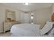 Bright bedroom featuring a comfortable bed, dresser, and a view to the next room at 9253 Windrift Way, Zionsville, IN 46077