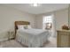 Inviting bedroom with natural light, a comfortable bed, and a window with views of the outdoors at 9253 Windrift Way, Zionsville, IN 46077