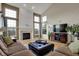 Spacious living room with vaulted ceilings, fireplace, hardwood floors, and plenty of natural light at 9253 Windrift Way, Zionsville, IN 46077