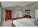Cozy main bedroom features a comfortable bed, closet, dresser with mirror and neutral colors at 9253 Windrift Way, Zionsville, IN 46077