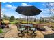 Outdoor patio with dining area set, beautiful pavers, and view of backyard with mature landscaping at 9253 Windrift Way, Zionsville, IN 46077