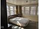 Bright bedroom with multiple windows, hard wood flooring, and a queen bed at 942 N Oxford St, Indianapolis, IN 46201