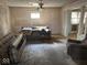 Living room featuring neutral walls, pillowed couch and vintage furnishings at 942 N Oxford St, Indianapolis, IN 46201