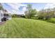 Large, well-manicured backyard with a deck, pergola, and plenty of space for outdoor activities at 10027 Landis Blvd, Fishers, IN 46040