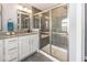 Modern bathroom with a glass-enclosed shower, granite countertop, and stylish fixtures at 10027 Landis Blvd, Fishers, IN 46040