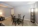 Comfortable dining area with a glass top table, four chairs, and a floor lamp with shelves at 10027 Landis Blvd, Fishers, IN 46040