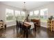 Dining room with large windows, a modern chandelier, and seating for six, perfect for Gathering gatherings at 10027 Landis Blvd, Fishers, IN 46040