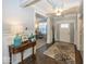 Elegant foyer with hardwood floors and an adjacent office space at 10027 Landis Blvd, Fishers, IN 46040