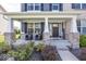 Inviting front porch with brick pillars and comfortable seating area at 10027 Landis Blvd, Fishers, IN 46040