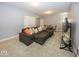 Spacious living room with a large sectional sofa, a glass coffee table, and recessed lighting at 10027 Landis Blvd, Fishers, IN 46040