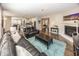 Spacious living room open to the kitchen, with hardwood floors and fireplace at 10027 Landis Blvd, Fishers, IN 46040