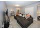 Cozy living room with a sectional sofa, a coffee table, and a entertainment center at 10027 Landis Blvd, Fishers, IN 46040