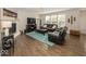 Cozy living room features a fireplace and hardwood floors at 10027 Landis Blvd, Fishers, IN 46040