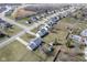 Overhead view of a neighborhood featuring a two-story home with a spacious yard and long driveway at 10212 Ironway Dr, Indianapolis, IN 46239