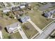 Aerial view of a home with a well-manicured lawn, surrounded by lush greenery, and neighboring houses at 10212 Ironway Dr, Indianapolis, IN 46239