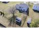 Aerial backyard view with partial tree coverage and two storage sheds at 10212 Ironway Dr, Indianapolis, IN 46239