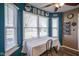 Bright dining area with large windows and blue accent wall at 10212 Ironway Dr, Indianapolis, IN 46239