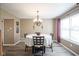 Cozy dining area featuring a round table with seating for four and natural light at 10212 Ironway Dr, Indianapolis, IN 46239