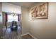 Open dining area with modern light fixture, hardwood floors and view to the outside at 10212 Ironway Dr, Indianapolis, IN 46239