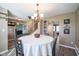 Cozy dining area featuring a round table with seating for four and natural light at 10212 Ironway Dr, Indianapolis, IN 46239