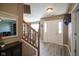 Welcoming foyer with wood flooring, stairs, and a view into the dining room at 10212 Ironway Dr, Indianapolis, IN 46239