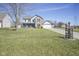 Lovely two-story home with a well-kept lawn, a cozy front porch, and an attached two-car garage at 10212 Ironway Dr, Indianapolis, IN 46239