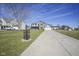 Spacious two-story home featuring a long driveway, a welcoming front porch, and a large front yard at 10212 Ironway Dr, Indianapolis, IN 46239