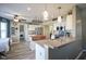 Bright, eat-in kitchen with stainless steel appliances, granite counters, and wood floors at 10212 Ironway Dr, Indianapolis, IN 46239