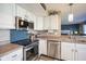 Modern kitchen featuring stainless steel appliances and white cabinets at 10212 Ironway Dr, Indianapolis, IN 46239