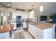 Stylish kitchen with stainless steel appliances, breakfast bar, and tiled backsplash at 10212 Ironway Dr, Indianapolis, IN 46239