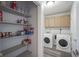 Convenient laundry area with shelving and washer/dryer at 10212 Ironway Dr, Indianapolis, IN 46239