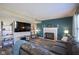 Inviting living room featuring a cozy fireplace, modern decor, and a comfortable couch at 10212 Ironway Dr, Indianapolis, IN 46239