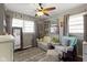 Cozy bedroom with neutral walls, wood floors, and a comfortable seating area at 10427 N Delaware St, Carmel, IN 46280