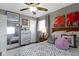This inviting bedroom features a ceiling fan, lots of artwork and neutral colors at 10427 N Delaware St, Carmel, IN 46280
