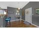 Inviting dining nook with a charming table set and view into the adjoining kitchen and living spaces at 10427 N Delaware St, Carmel, IN 46280