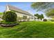 Expansive backyard featuring mature landscaping, an extended deck, and well-maintained lawn at 10725 Grindstone Dr, Fishers, IN 46037
