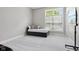 Bright bedroom featuring neutral walls, plush carpeting, and a modern daybed at 10725 Grindstone Dr, Fishers, IN 46037