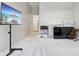 Bonus room featuring neutral walls, plush carpeting, and a television at 10725 Grindstone Dr, Fishers, IN 46037