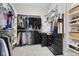 Organized walk-in closet with ample shelving and hanging space for clothes and accessories at 10725 Grindstone Dr, Fishers, IN 46037
