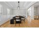 Dining room with modern light fixture and wainscotting at 10725 Grindstone Dr, Fishers, IN 46037