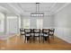 Dining room with a modern chandelier and seating for six at 10725 Grindstone Dr, Fishers, IN 46037