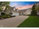 Charming two-story home boasts a three-car garage, beautiful landscaping, and a welcoming front porch at 10725 Grindstone Dr, Fishers, IN 46037